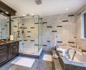 Tile-finished big bathroom with dark wooden vanity